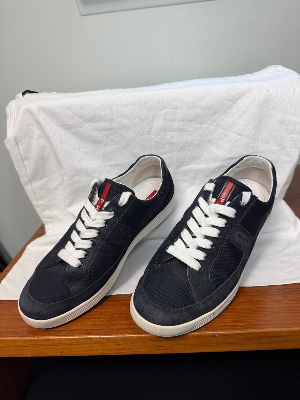 Prada Navy and White Low-Top Sneakers with Red Tongue Accent